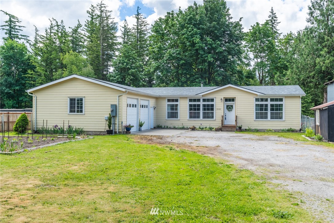 2065 East Pole Road Everson, WA 98247 - Photo 6 of 40 a view of a yard with a house