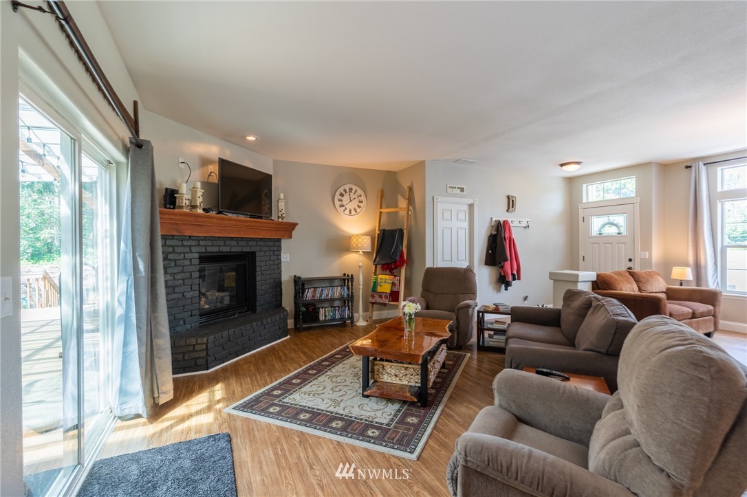 2065 East Pole Road Everson, WA 98247 - Photo 9 of 40 a living room with furniture and a fireplace