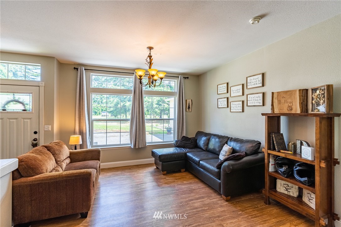 2065 East Pole Road Everson, WA 98247 - Photo 10 of 40 a living room with furniture and a flat screen tv