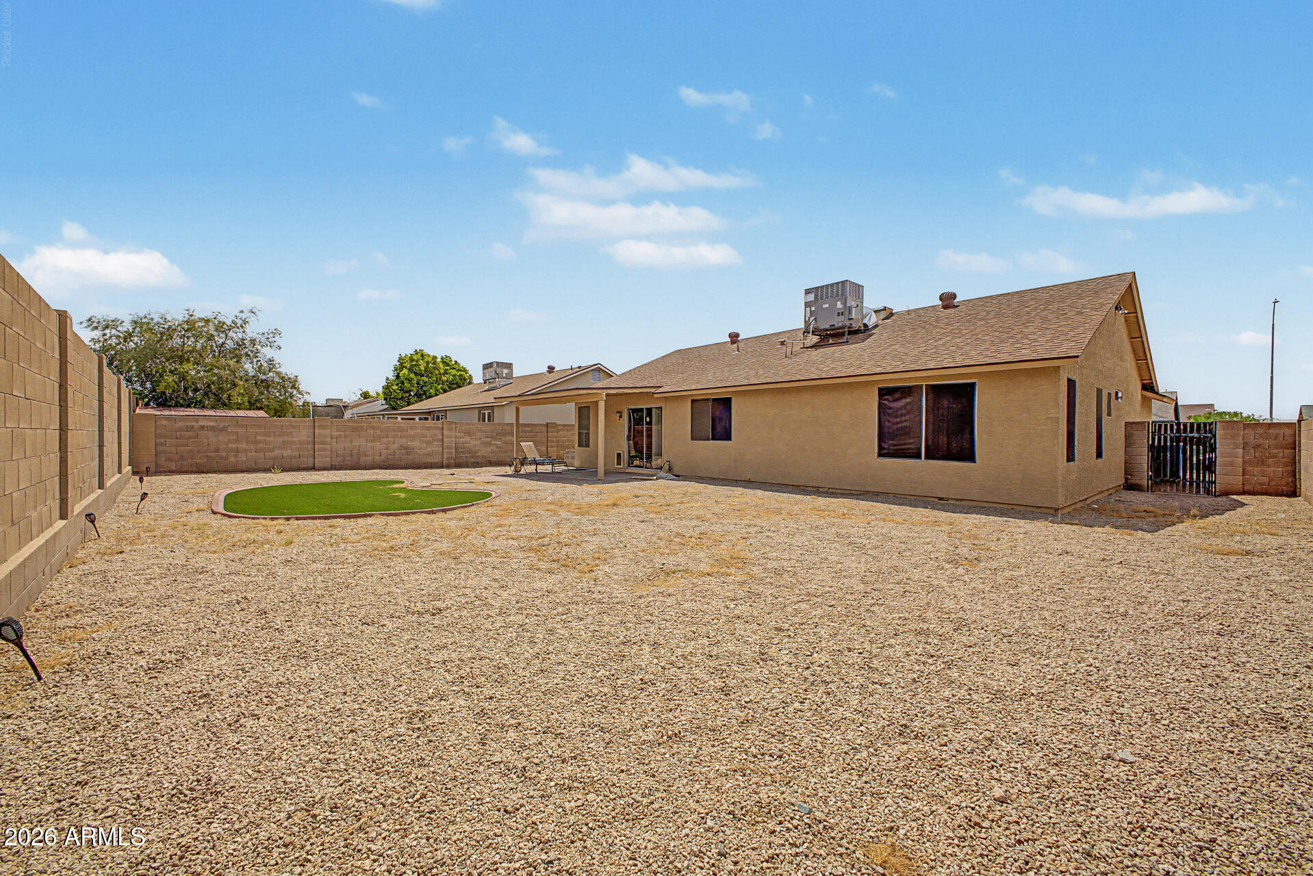 8564 West Ocotillo Road Glendale, AZ 85305 - Photo 33 of 34 a front view of a house with a yard and garage