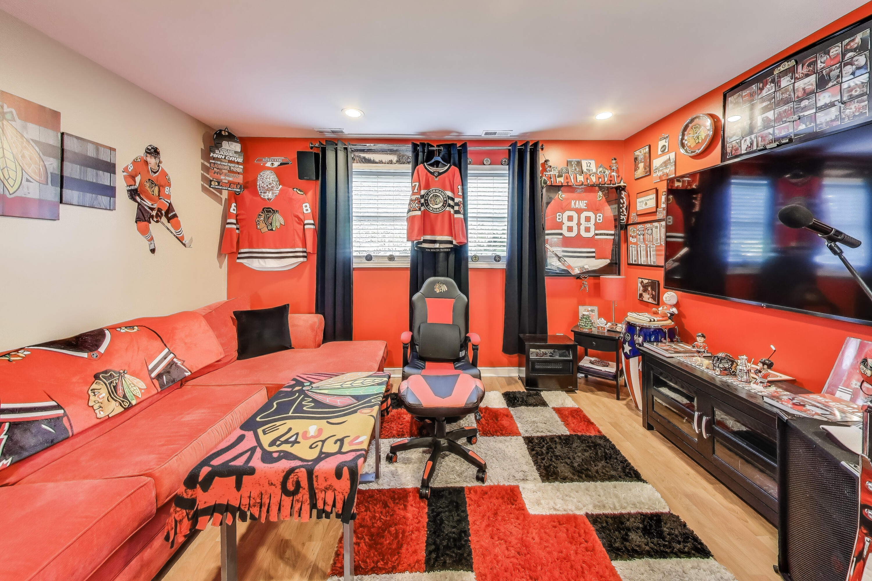 1235 West 99th Avenue Crown Point, IN 46307 - Photo 16 of 54 a bedroom with furniture and a flat screen tv