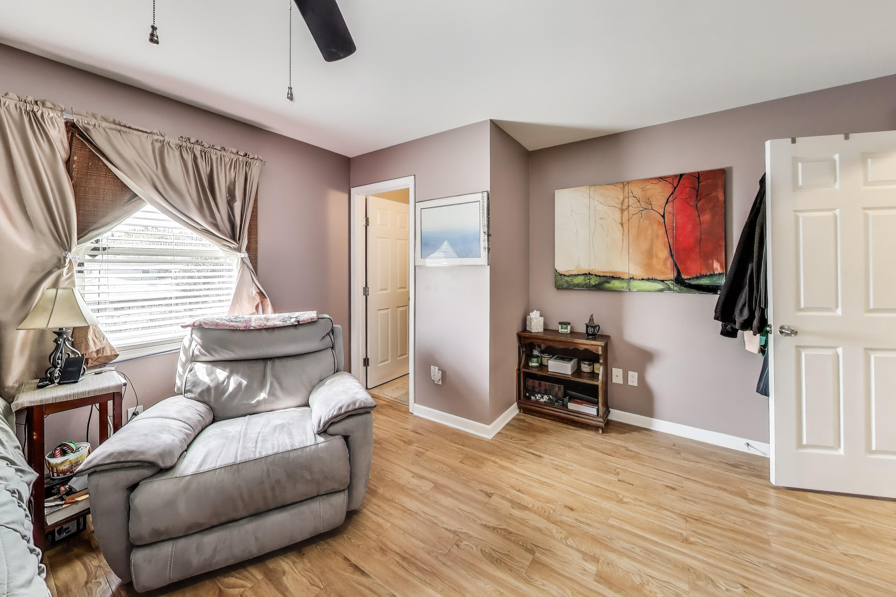 1235 West 99th Avenue Crown Point, IN 46307 - Photo 19 of 54 a living room with furniture and a flat screen tv