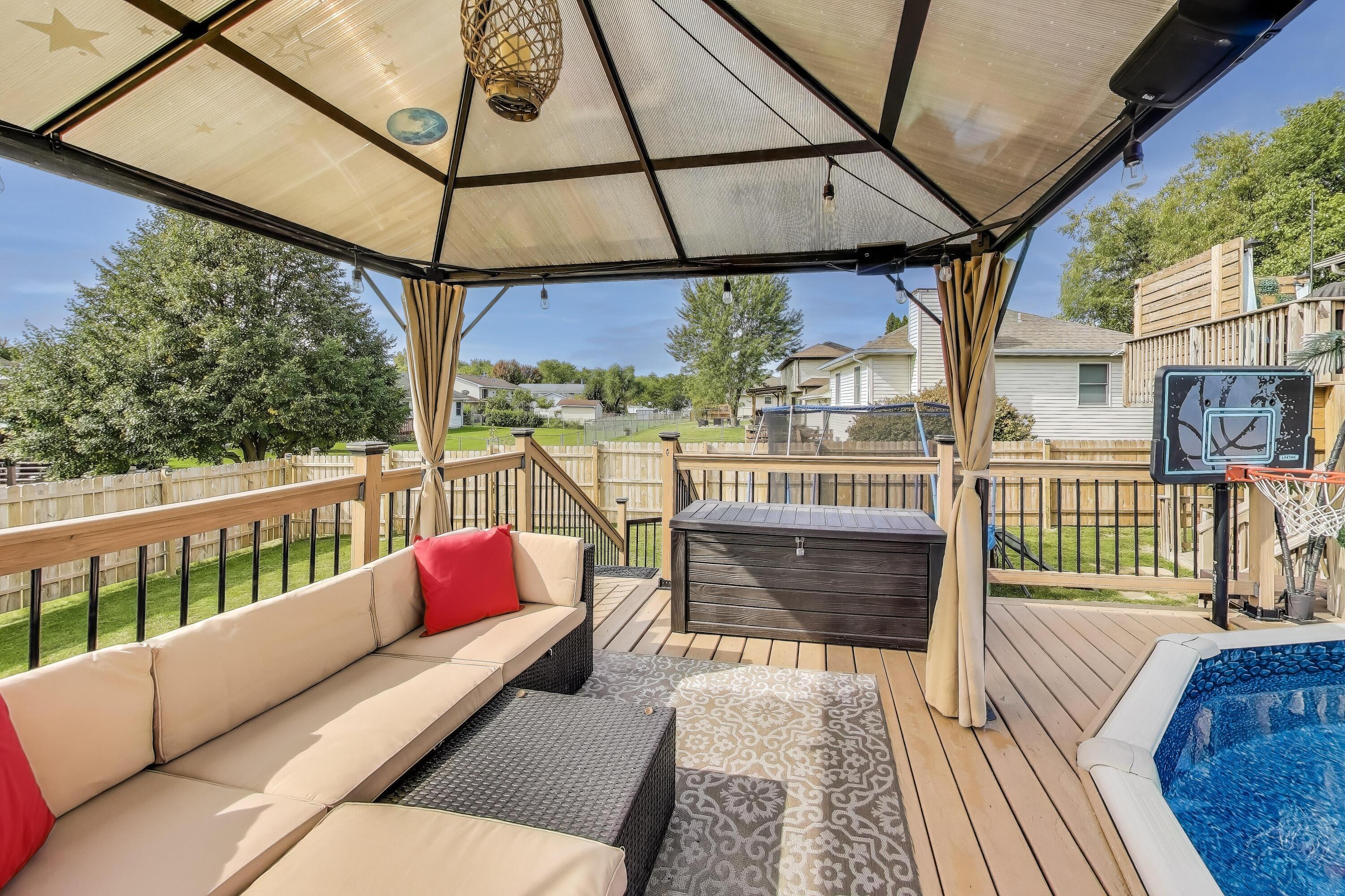 1235 West 99th Avenue Crown Point, IN 46307 - Photo 30 of 54 a view of deck with a table and chairs