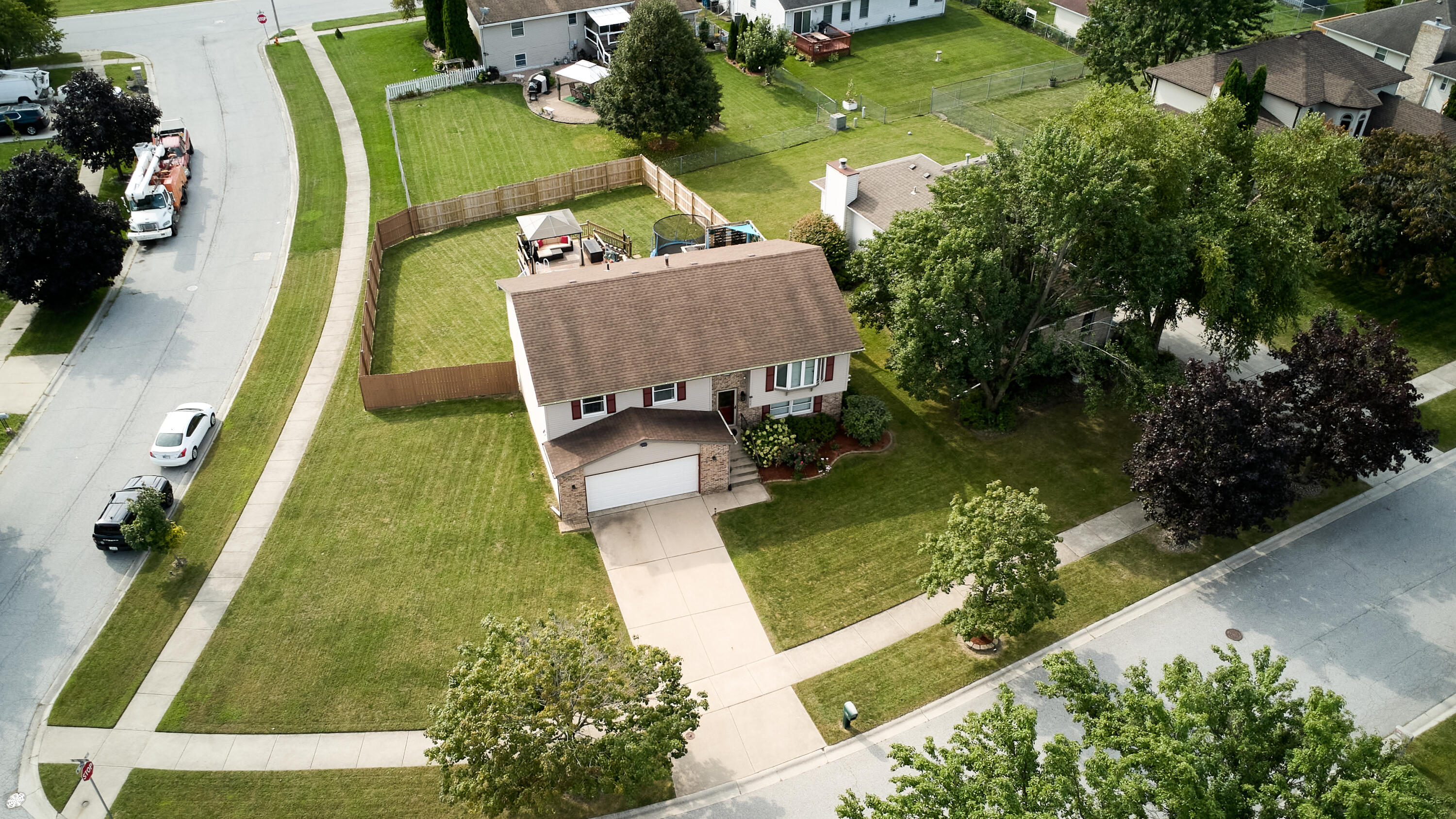 1235 West 99th Avenue Crown Point, IN 46307 - Photo 34 of 54 an aerial view of a house with swimming pool garden and patio