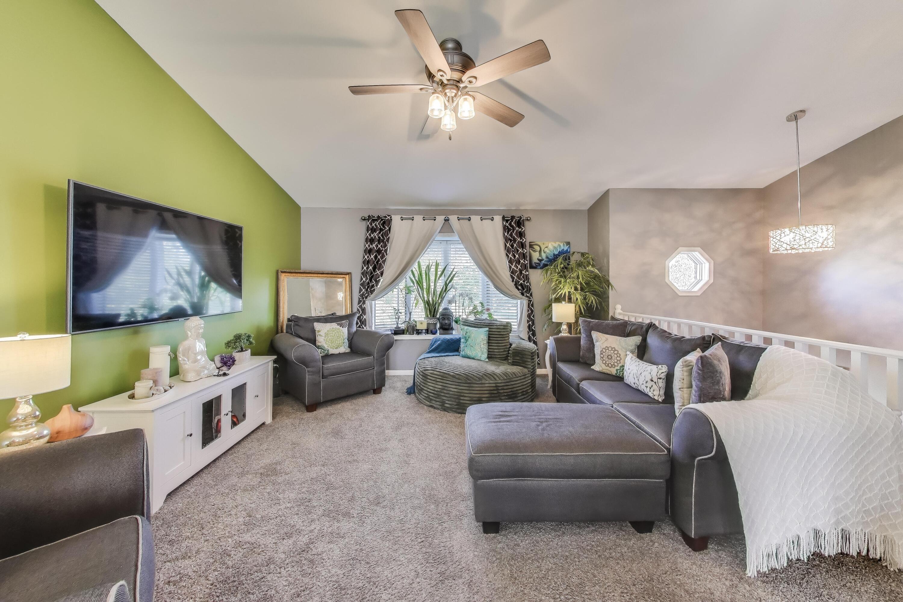 1235 West 99th Avenue Crown Point, IN 46307 - Photo 4 of 54 a living room with furniture and a flat screen tv