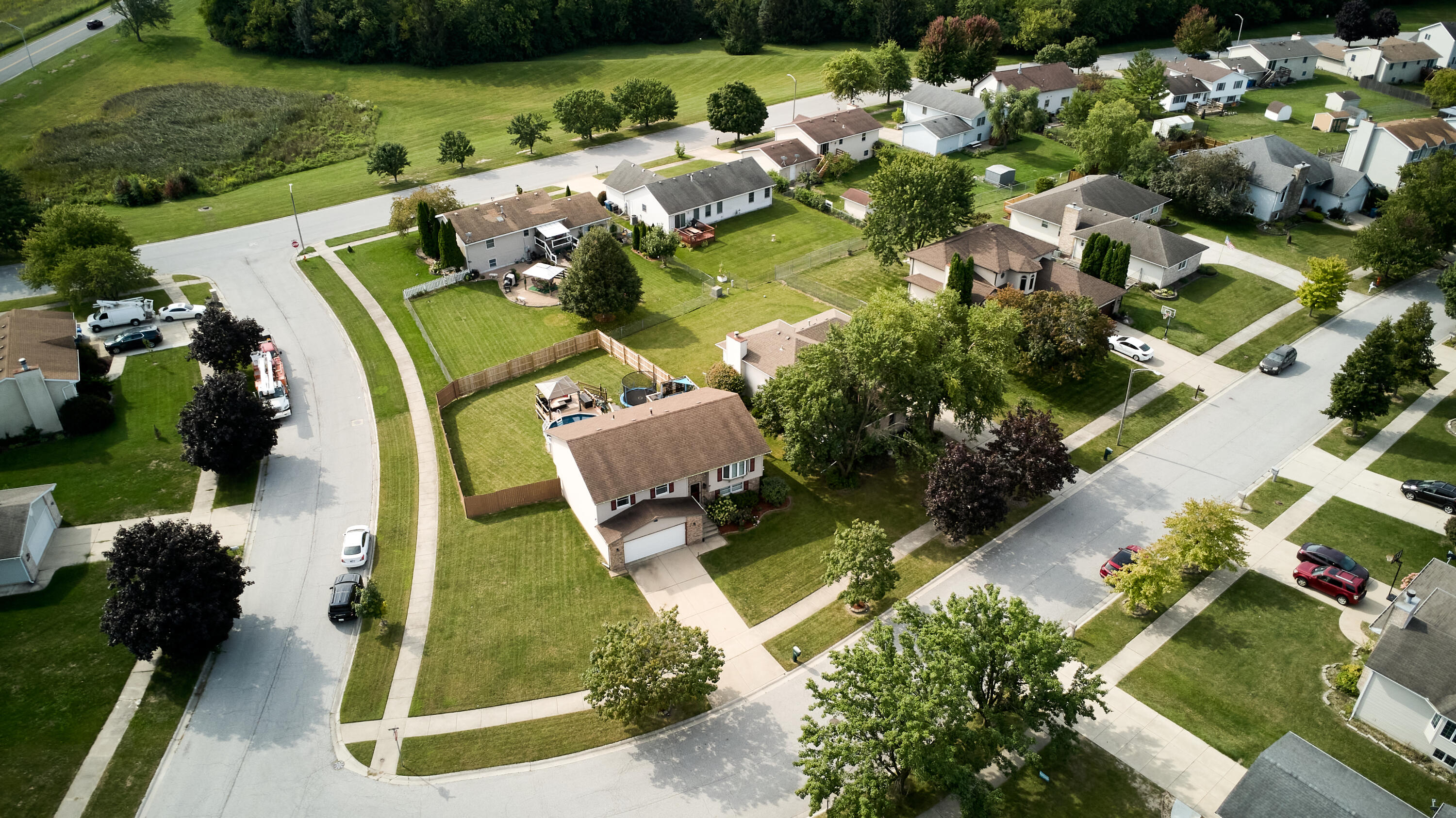 1235 West 99th Avenue Crown Point, IN 46307 - Photo 41 of 54 an aerial view of a house with garden space and street view