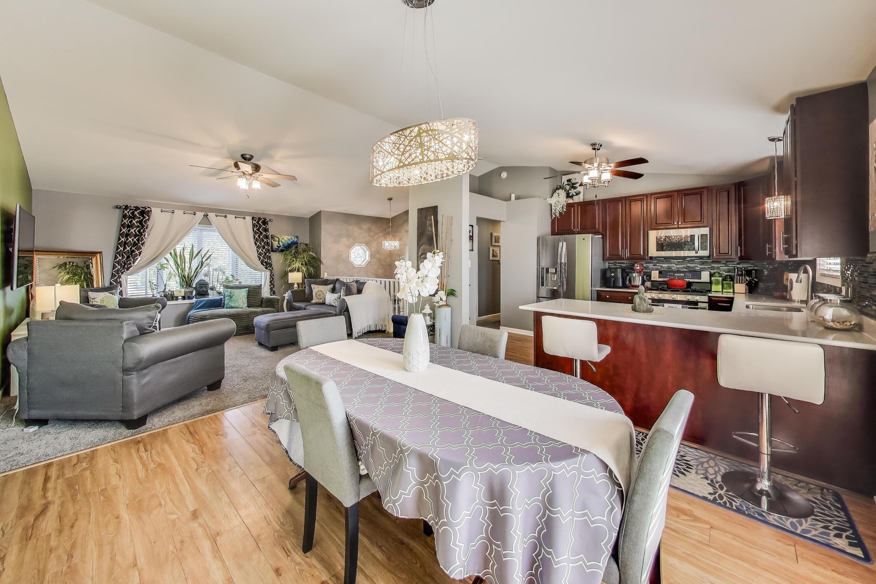 1235 West 99th Avenue Crown Point, IN 46307 - Photo 9 of 54 a large kitchen with a table and chairs