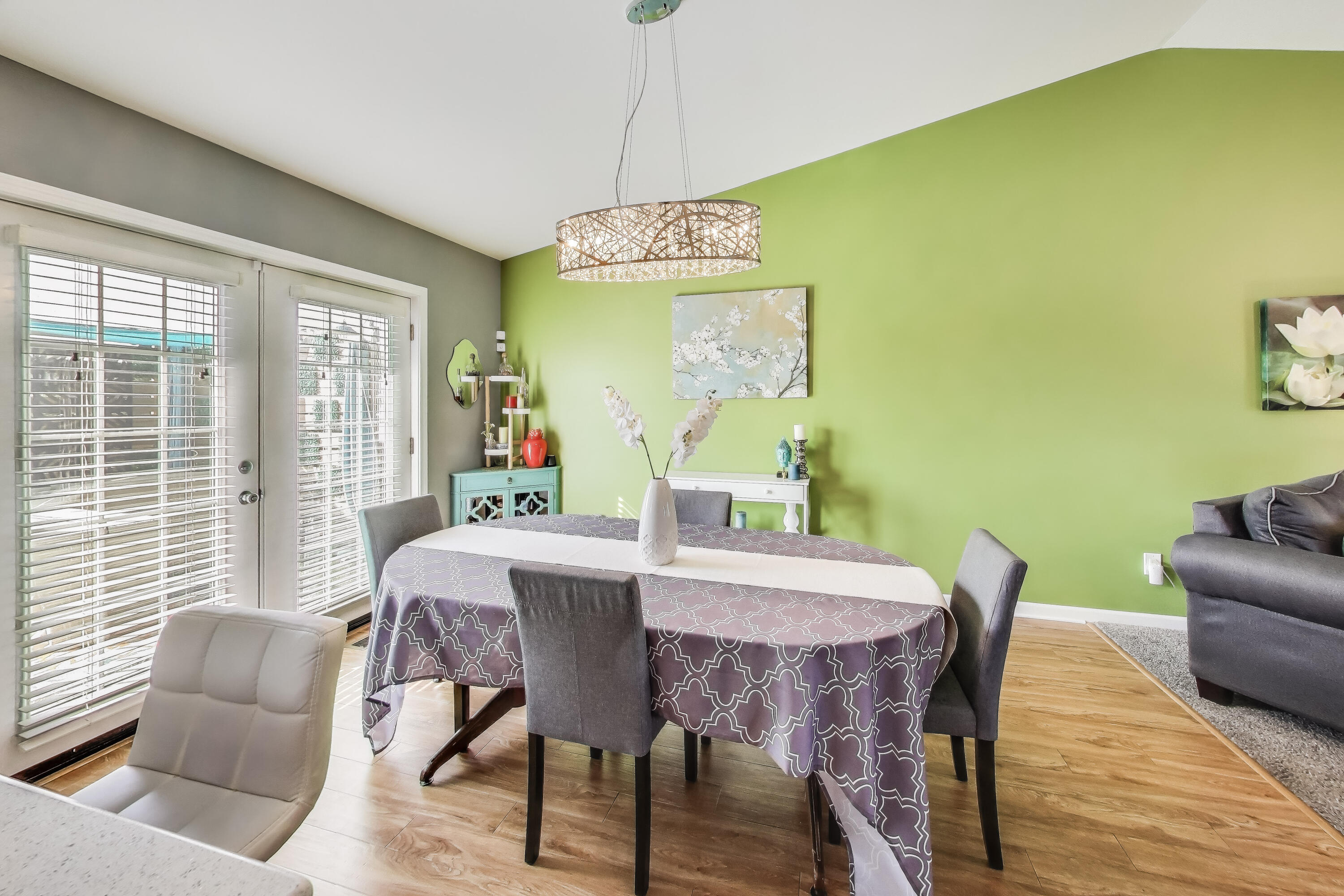 1235 West 99th Avenue Crown Point, IN 46307 - Photo 10 of 54 a view of a dining room with furniture and wooden floor
