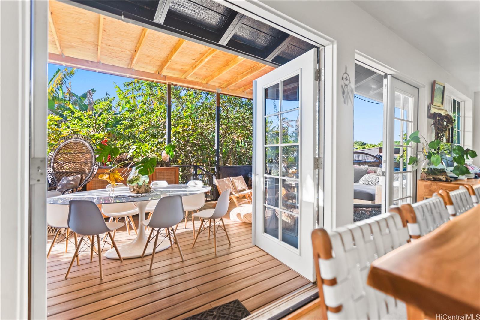 4 Kaukonahua Road Waialua, HI 96791 - Photo 11 of 25 a view of a dining room with furniture wooden floor and garden view