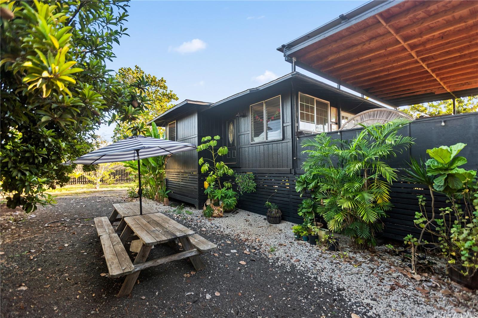 4 Kaukonahua Road Waialua, HI 96791 - Photo 8 of 25 a view of a backyard with plants and a patio