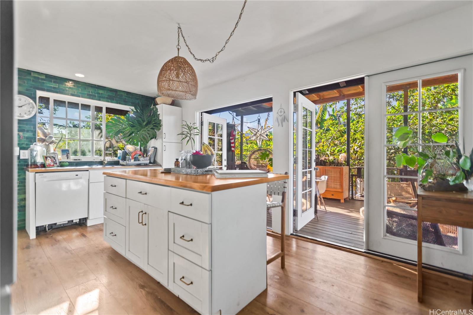 4 Kaukonahua Road Waialua, HI 96791 - Photo 9 of 25 a kitchen with granite countertop a stove a sink and a large window