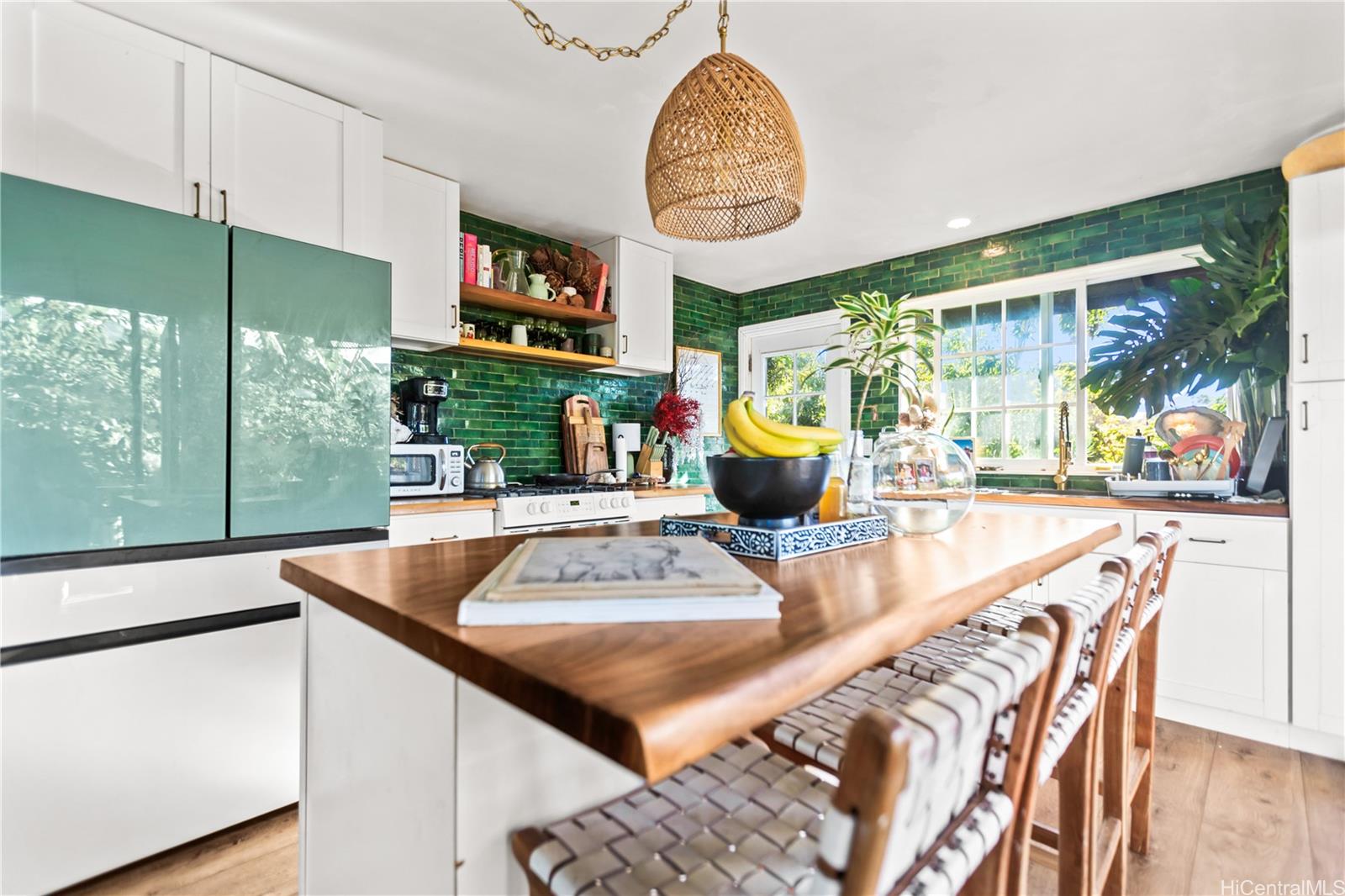 4 Kaukonahua Road Waialua, HI 96791 - Photo 10 of 25 a view of a dining room with furniture a chandelier and wooden floor