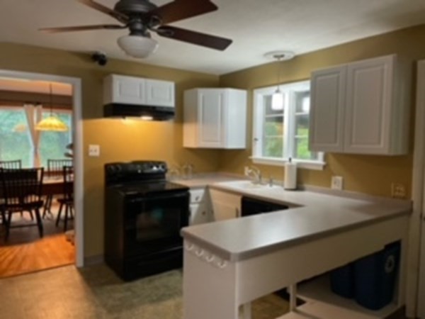 15 Steiger Road Holyoke, MA 01040 - Photo 11 of 29 a kitchen with a stove a sink and a refrigerator
