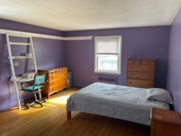 15 Steiger Road Holyoke, MA 01040 - Photo 23 of 29 a bedroom with a bed a table and chair