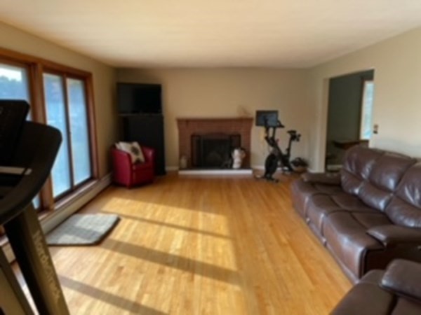 15 Steiger Road Holyoke, MA 01040 - Photo 5 of 29 a living room with furniture a flat screen tv and a fireplace