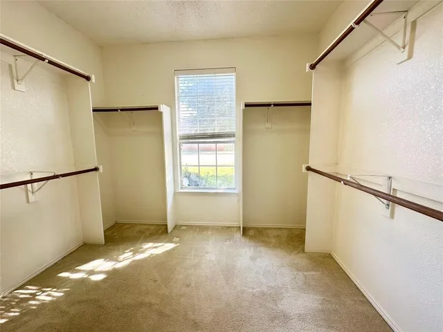 a bathroom with a tub shower and sink