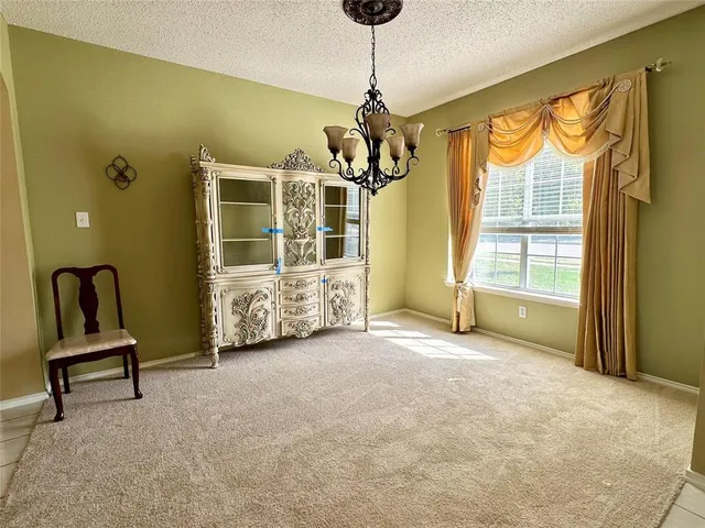 a kitchen with stainless steel appliances granite countertop a stove a refrigerator and a sink