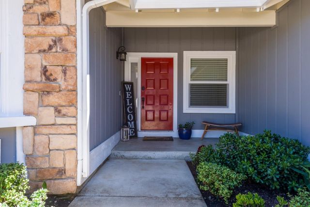 a front view of a house with a yard