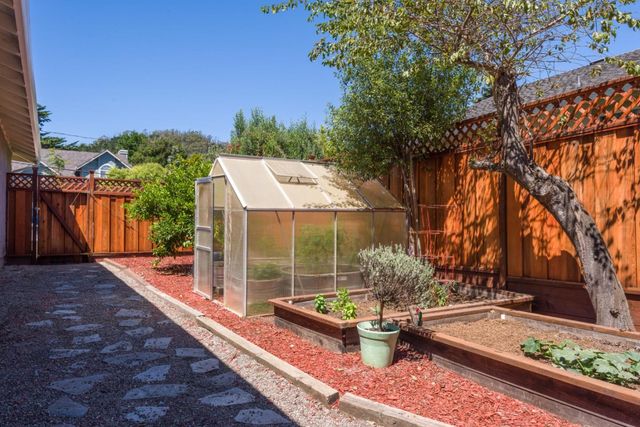 a view of a backyard with sitting area
