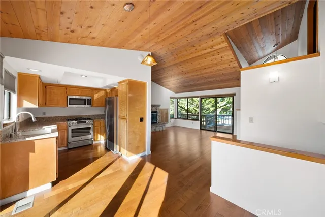 a view of a kitchen with a stove top oven