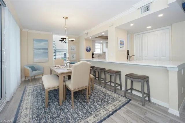a kitchen with stainless steel appliances a refrigerator sink and cabinets