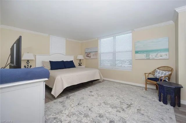 a bathroom with a tub sink vanity and mirror