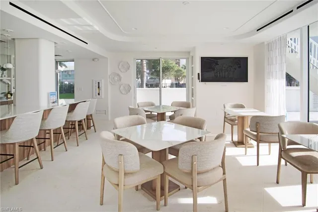 a living room with furniture fireplace and flat screen tv