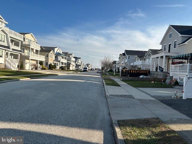 3200 West Brigantine Avenue, Unit 6 Brigantine, NJ 08203 - Photo 13 of 17 a city view with tall buildings and cars parked on road