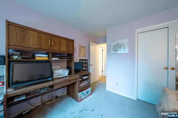 a room with furniture and flat screen tv