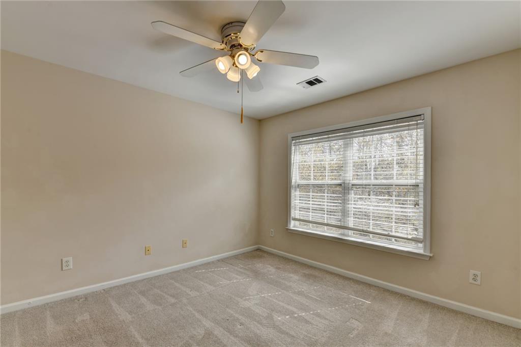 100 Hawnley Trc Northwest Suwanee, GA 30024 - Photo 50 of 58 a view of an empty room with a window