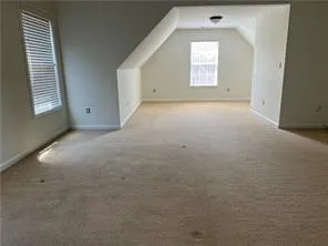 an empty room that has a window in it