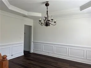 a view of a chandelier in an empty room