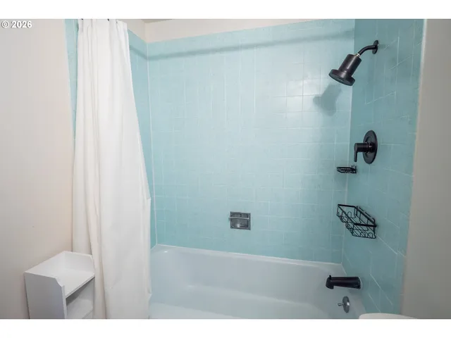 a view of a house with a yard and garage