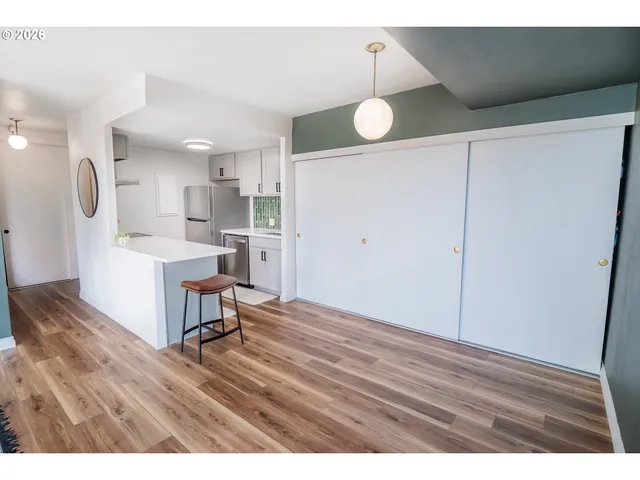 a view of kitchen with cabinets and wooden floor