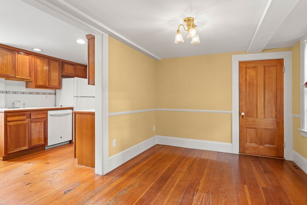 2 High Street Marblehead, MA 01945 - Photo 8 of 35 a view of a kitchen with wooden floor and a sink
