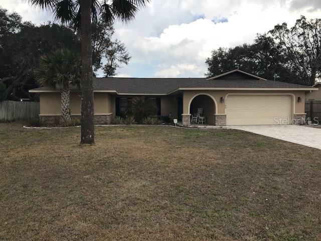 11103 Sheffield Road Spring Hill, FL 34608 - Photo 1 of 1 Exterior front with brick paver driveway and walkway