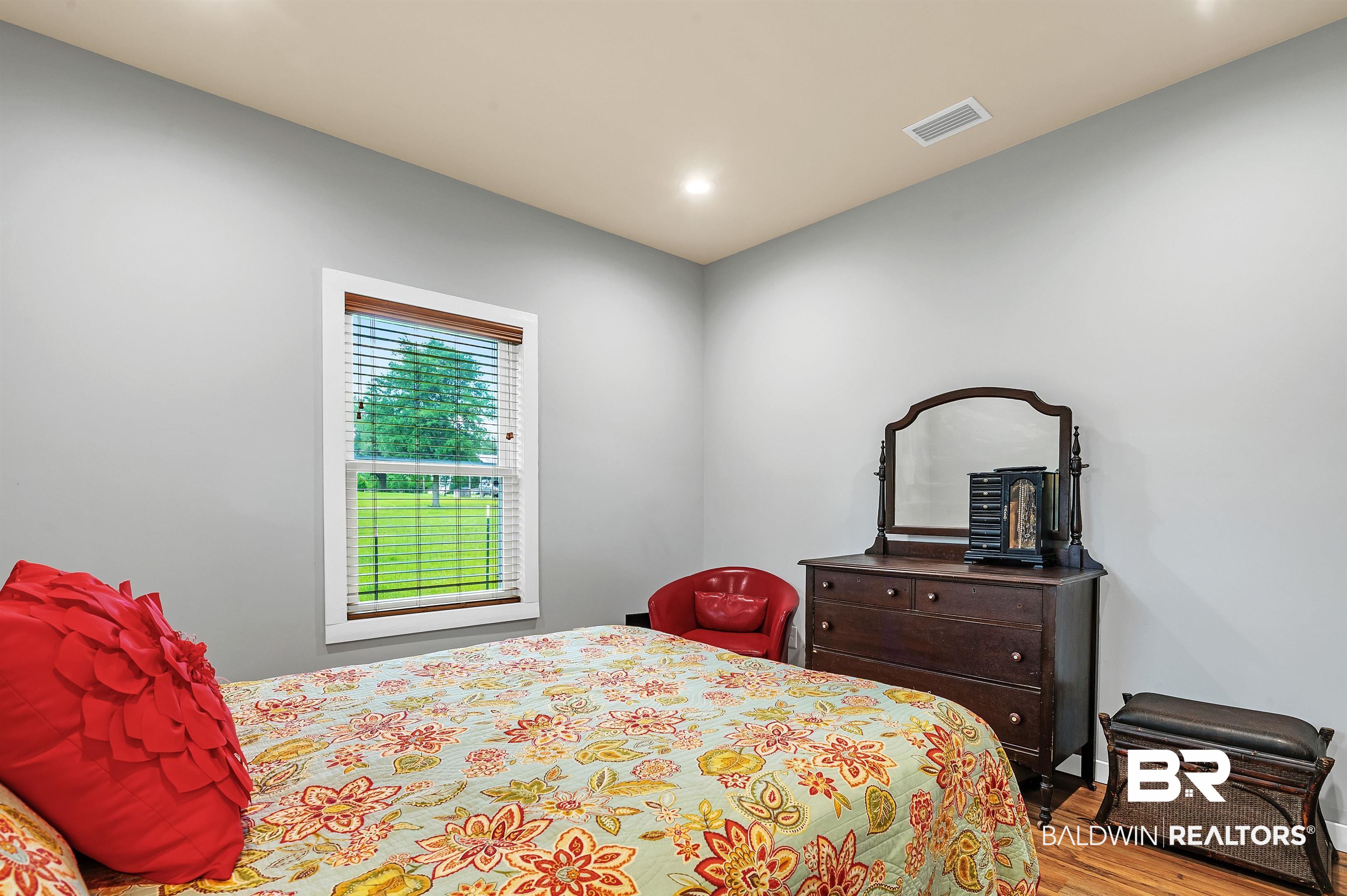 13827 County Road 83 Elberta, AL 36530 - Photo 32 of 38 Bedroom featuring wood finished floors and recessed lighting