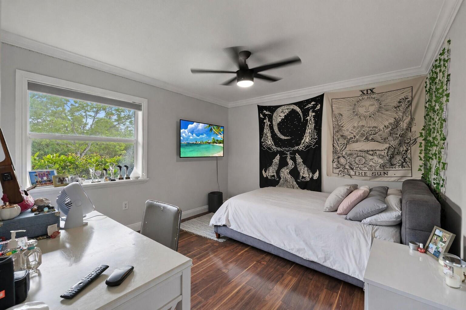 5701 Southwest 136th Street Miami, FL 33156 - Photo 15 of 25 a bedroom with a bed and a desk