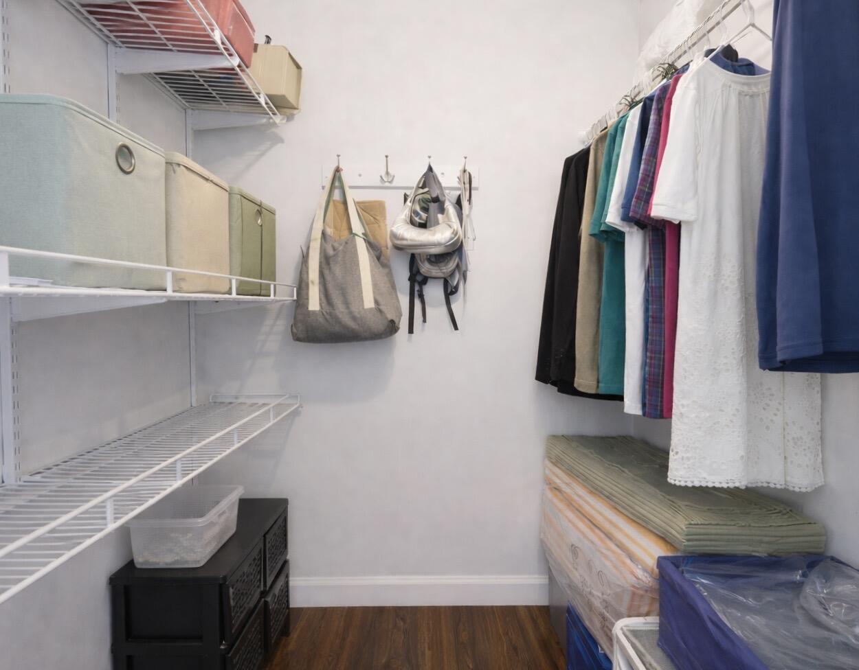 5701 Southwest 136th Street Miami, FL 33156 - Photo 16 of 25 a view of walk in closet with clothes and shoes