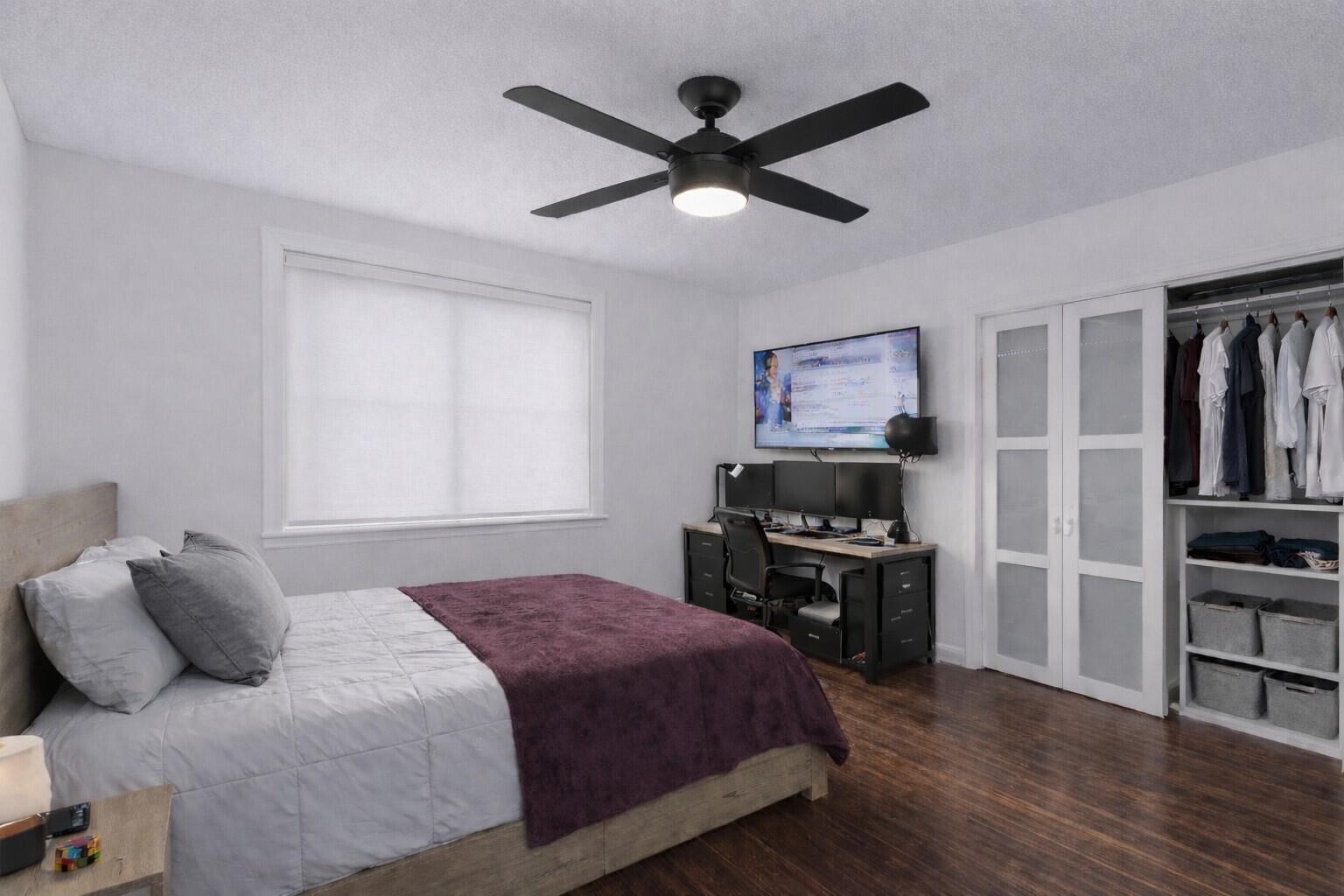 5701 Southwest 136th Street Miami, FL 33156 - Photo 18 of 25 a bedroom with a bed and wooden floor