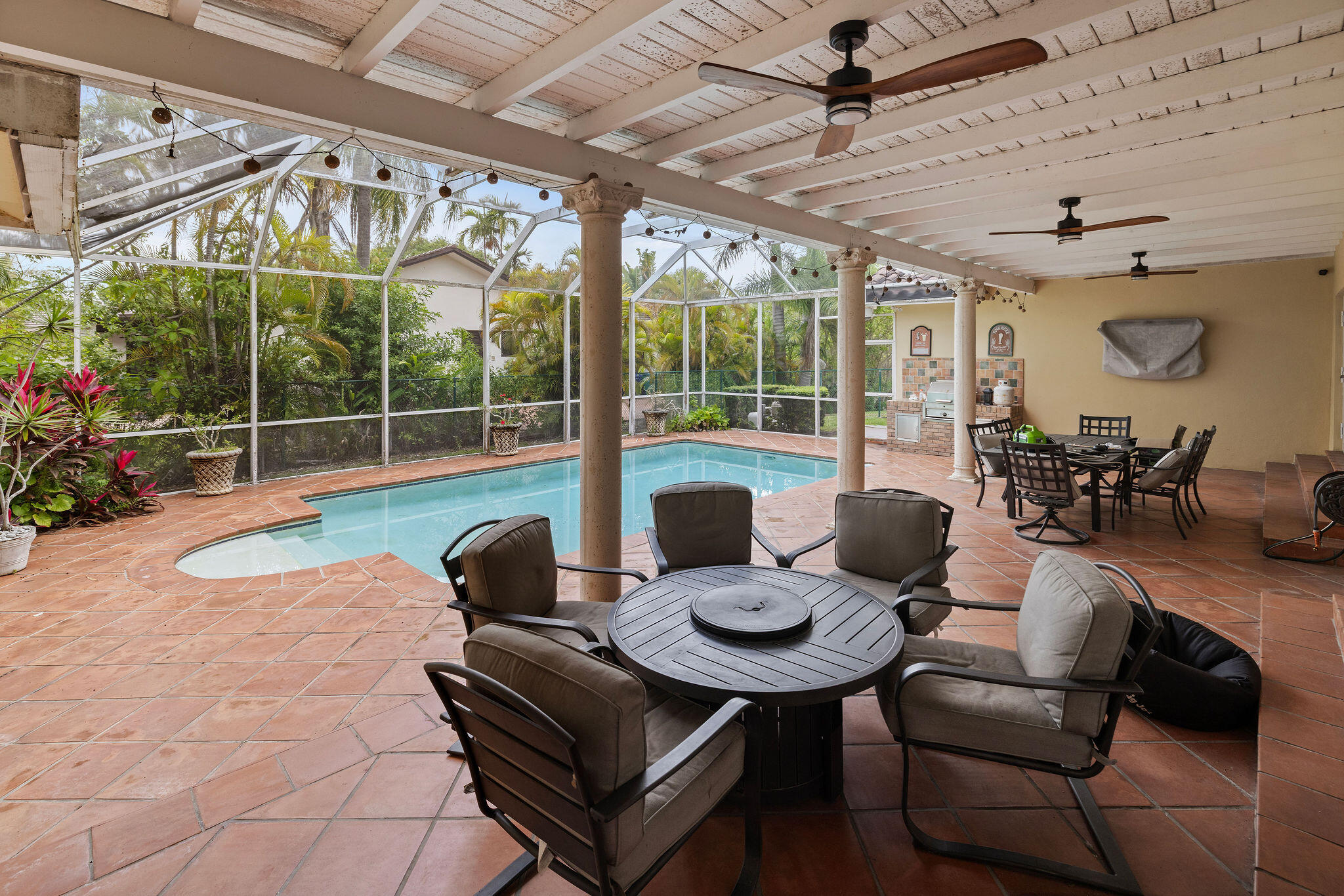 5701 Southwest 136th Street Miami, FL 33156 - Photo 22 of 25 a outdoor space with patio couch and chairs