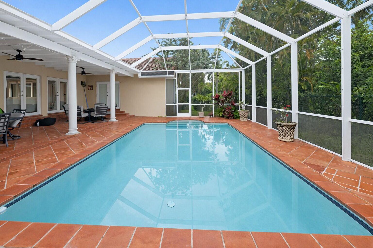 5701 Southwest 136th Street Miami, FL 33156 - Photo 23 of 25 a view of a backyard with a swimming pool