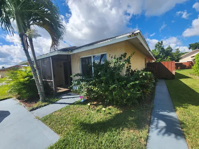 a view of a backyard with plants
