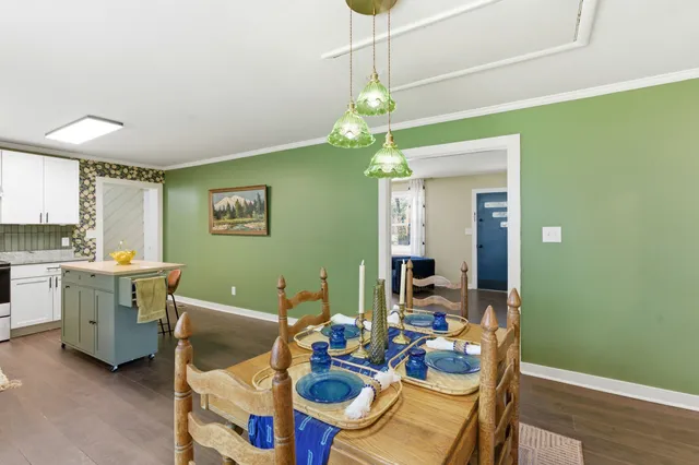 a view of a wooden deck with a yard