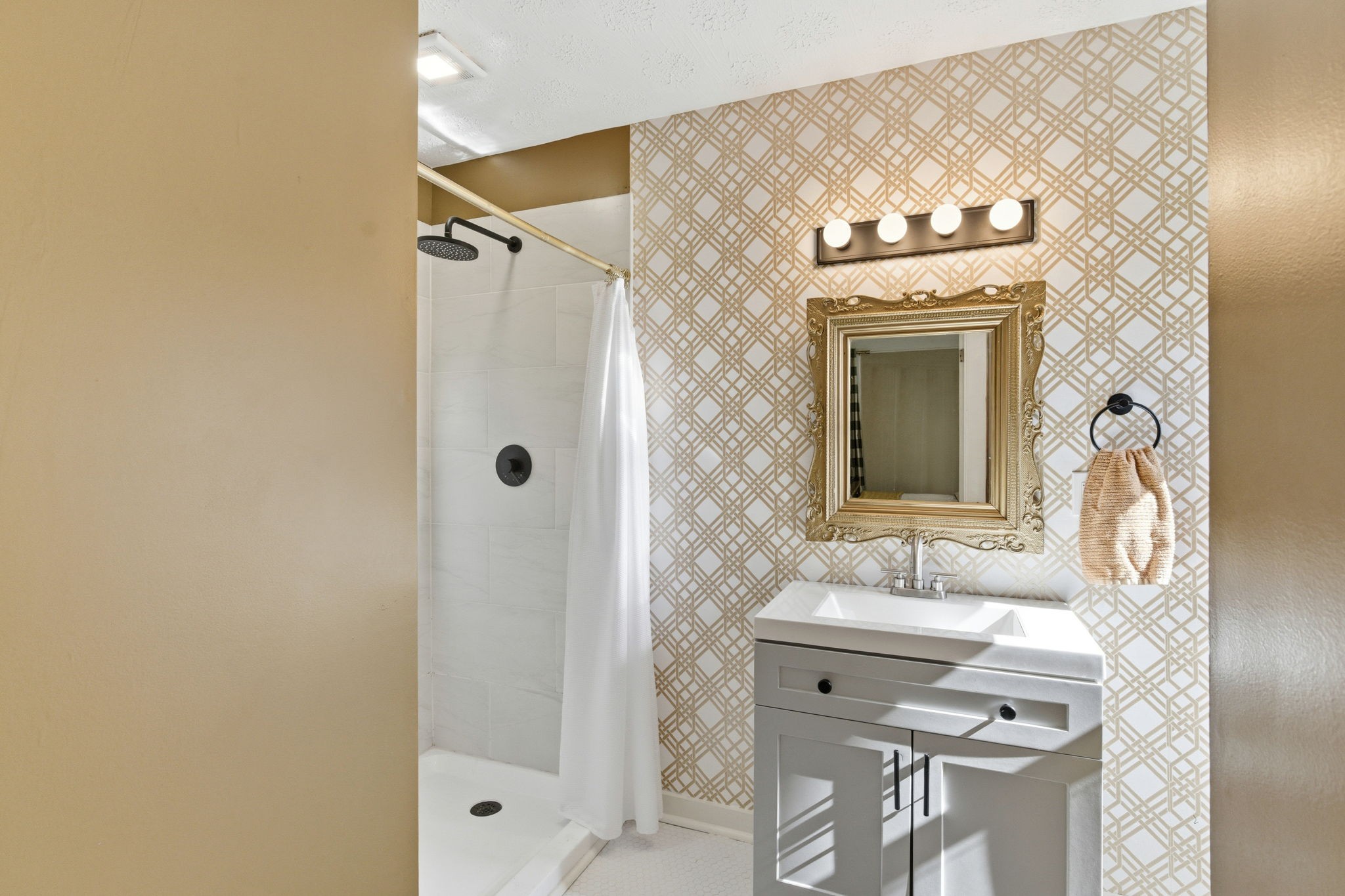 1116 Slaters Creek Road Goodlettsville, TN 37072 - Photo 16 of 36 a bathroom with a sink mirror and a shower