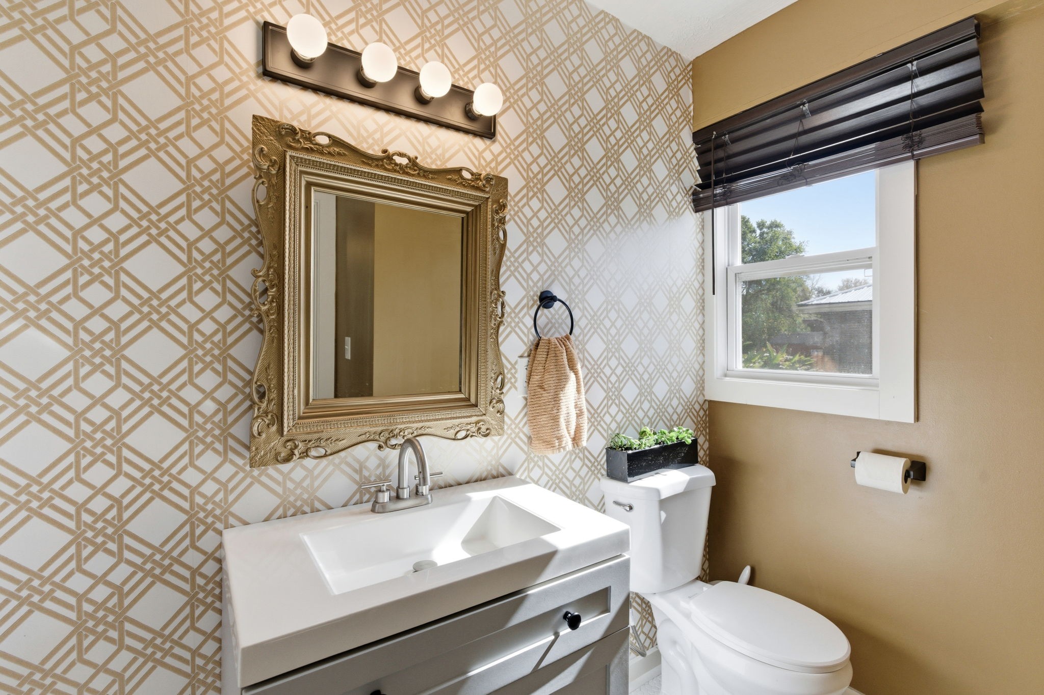 1116 Slaters Creek Road Goodlettsville, TN 37072 - Photo 17 of 36 a bathroom with a sink a toilet and mirror