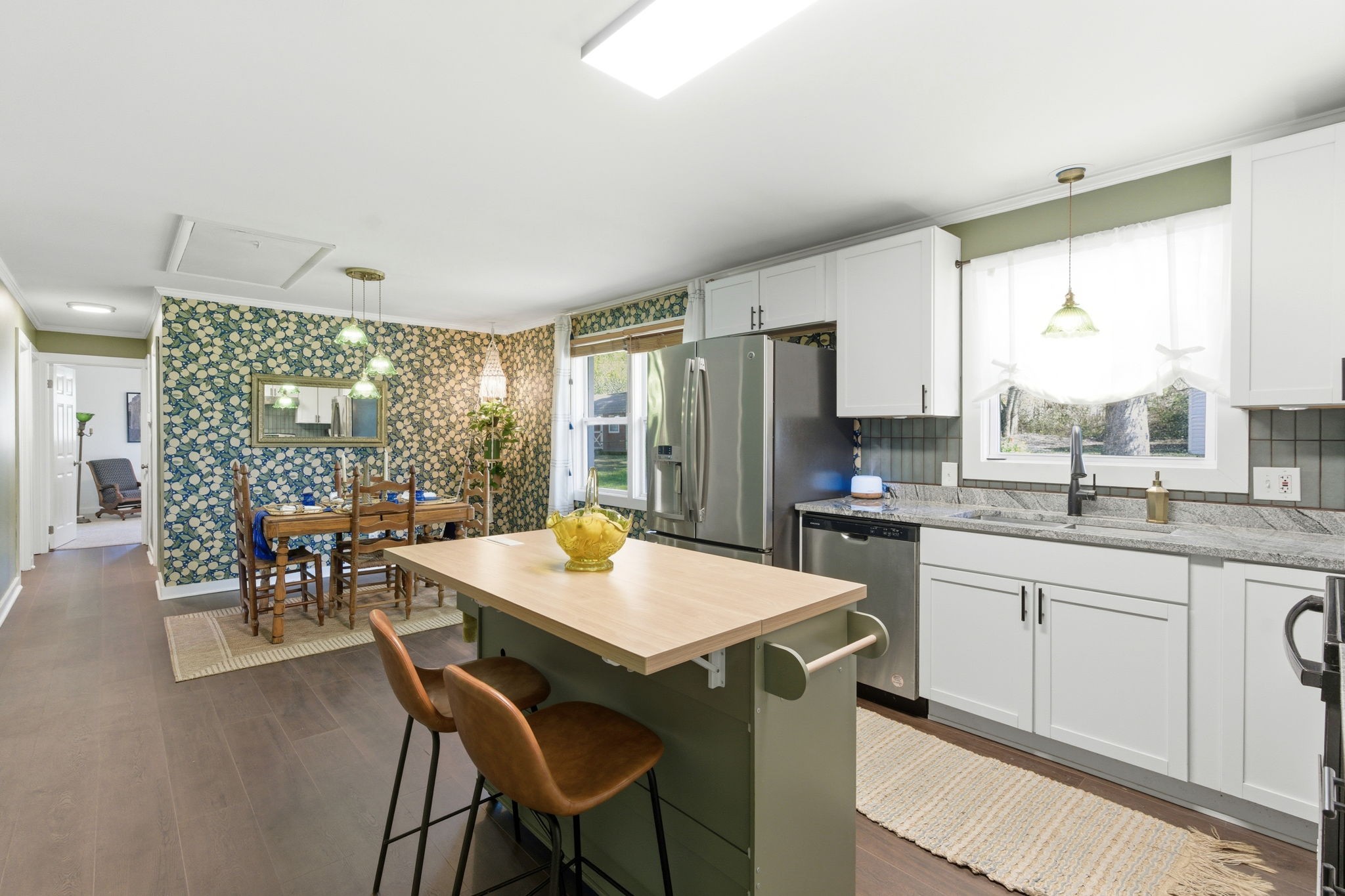 1116 Slaters Creek Road Goodlettsville, TN 37072 - Photo 8 of 36 a kitchen with a table chairs sink and refrigerator