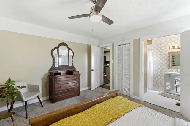 a bathroom with a toilet a sink and a mirror