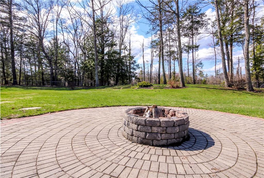 16 Ridge Road Westbrook, ME 04092 - Photo 28 of 35 Expansive patio with fire pit. Ready...