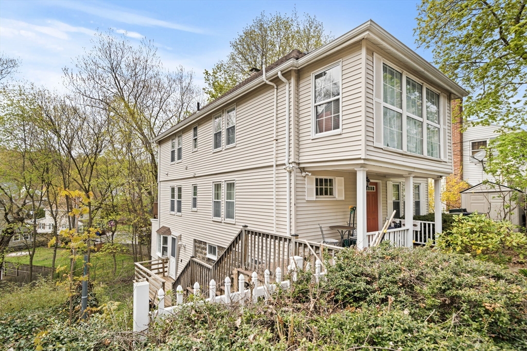 25 Pinedale Road, Unit 1 Boston, MA 02131 - Photo 2 of 21 front view of a house with a yard